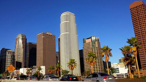 Modern buildings against clear blue sky