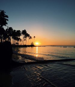 Scenic view of sea at sunset