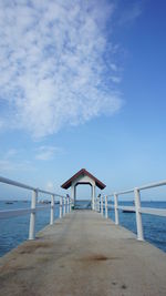 Lifeguard hut on beach against sky