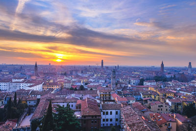 High angle view of buildings in city against sky during sunset