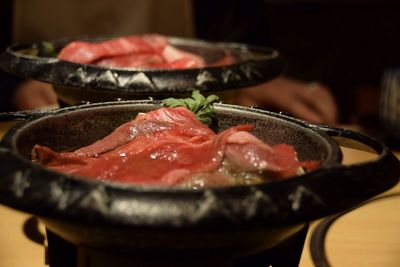 Close-up of meat in cooking pan