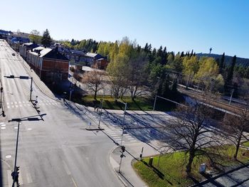 High angle view of trees and buildings against clear sky