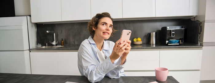 Young woman using mobile phone