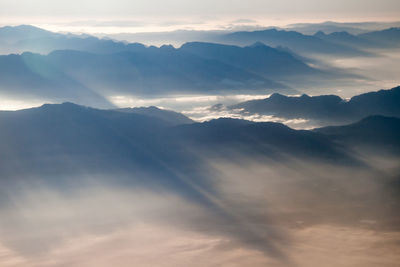 Scenic view of mountains against sky during sunset