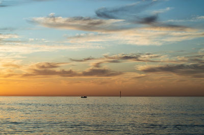 Scenic view of sea against sky during sunrise
