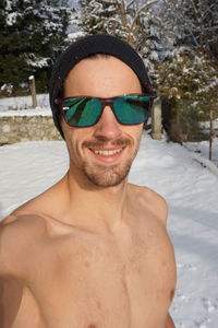 Portrait of young man in snow