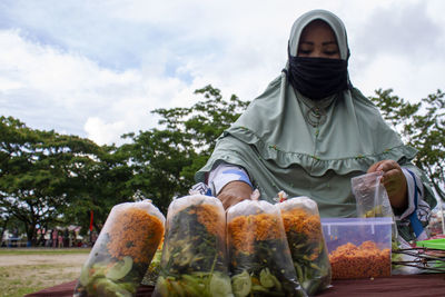 Women and the wives of indonesian fishermen selling various culinary to breaking fast for muslims.