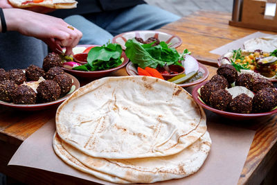 Midsection of man preparing food on table