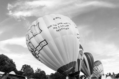 Low angle view of balloons against sky