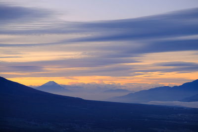 Scenic view of mountains against sky during sunset