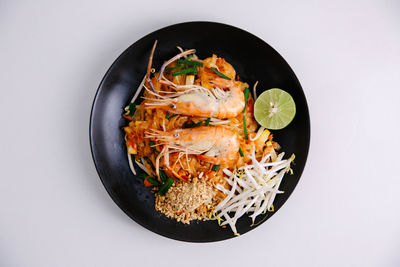 High angle view of food in bowl against white background