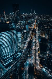 Aerial view of illuminated city at night