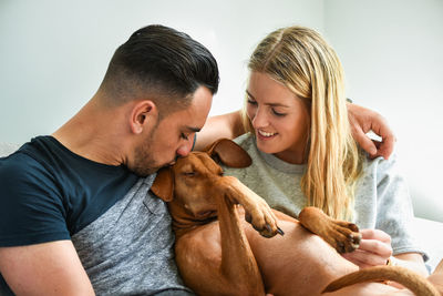 Portrait of couple with dog