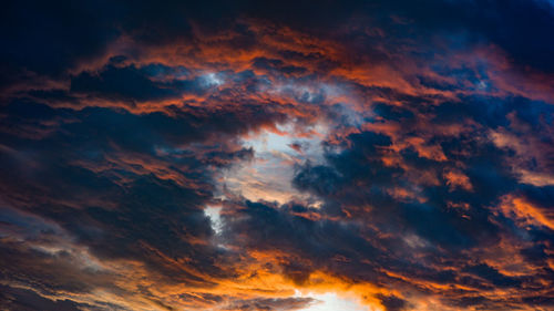 Low angle view of dramatic sky during sunset