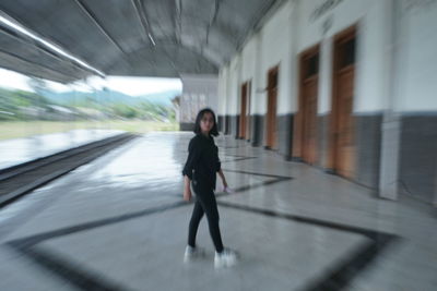 Full length of man walking in bus