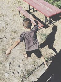 Low section of boy playing on floor