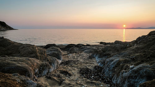 Scenic view of sea against sky during sunset