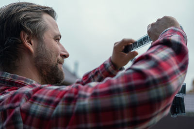 Close-up of man smoking cigarette