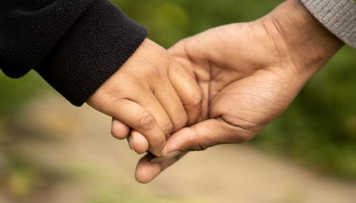 Close-up of hand holding hands