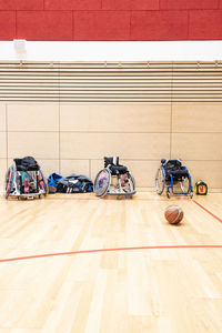 Bicycles on hardwood floor against wall