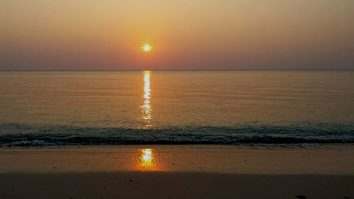 Scenic view of sea at sunset