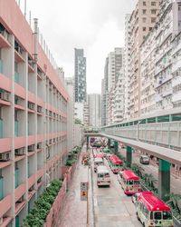 Vehicles on road along buildings