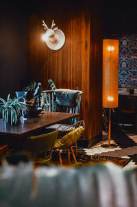 Illuminated lamps on table at restaurant