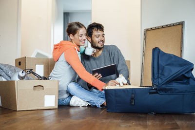 Young couple looking at camera