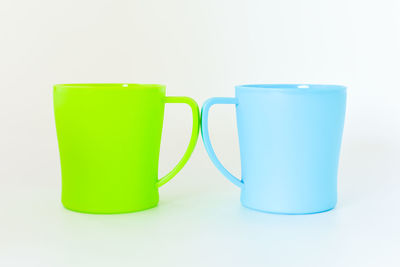 Close-up of empty glasses against white background