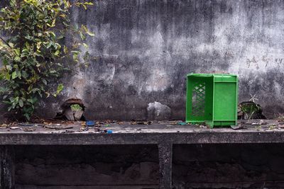 Green table against wall in old building