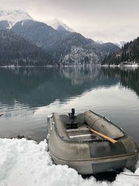 Scenic view of lake against sky during winter