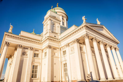 Low angle view of building against blue sky