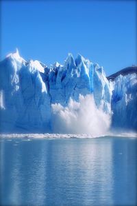 Ice calving from glacier to sea