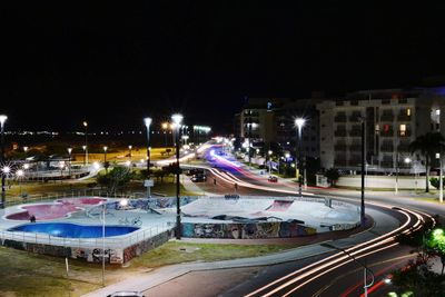 High angle view of light trails on road at night