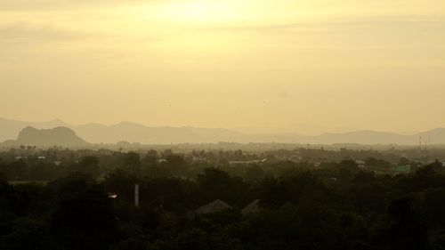 Scenic view of cityscape against sky during sunset