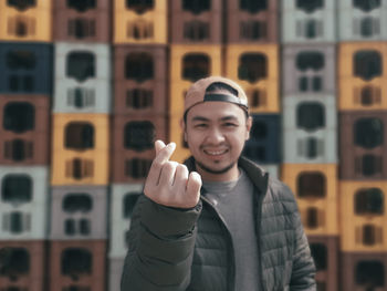 Portrait of smiling young man standing outdoors