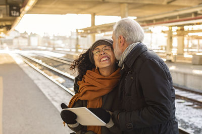 Mature couple on train station platform