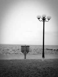 Lifeguard hut on beach against clear sky