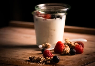 Close-up of strawberries in glass on table