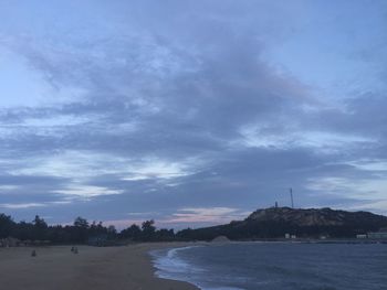 Scenic view of sea against cloudy sky