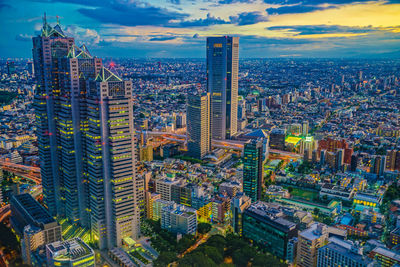 High angle view of modern buildings in city against sky