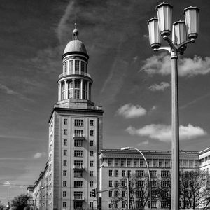 Low angle view of building against cloudy sky