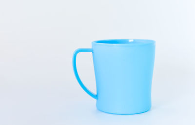 Close-up of coffee cup against white background