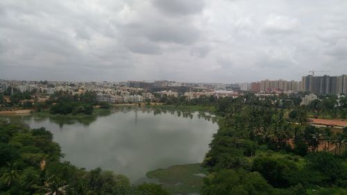 High angle view of buildings and trees against sky