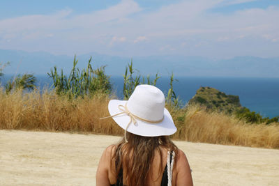 Rear view of woman looking at sea shore