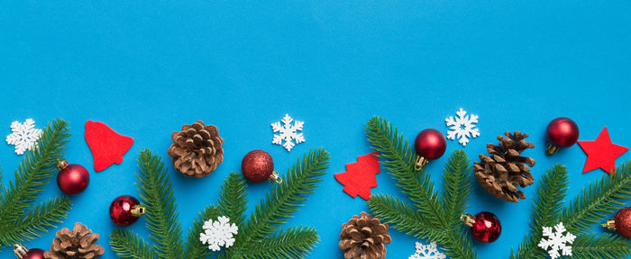 Close-up of christmas tree against blue background