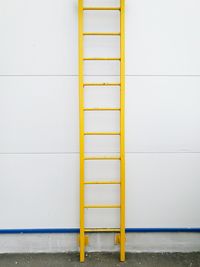 Close-up of yellow ladder 