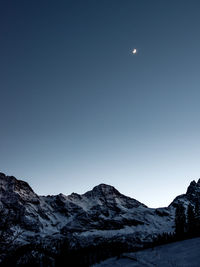 Scenic view of mountains against clear blue sky