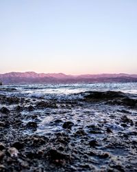 Scenic view of sea against clear sky during sunset