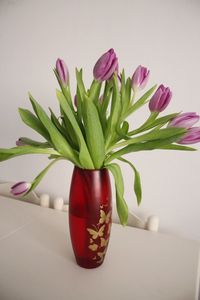 Close-up of pink flower vase on table